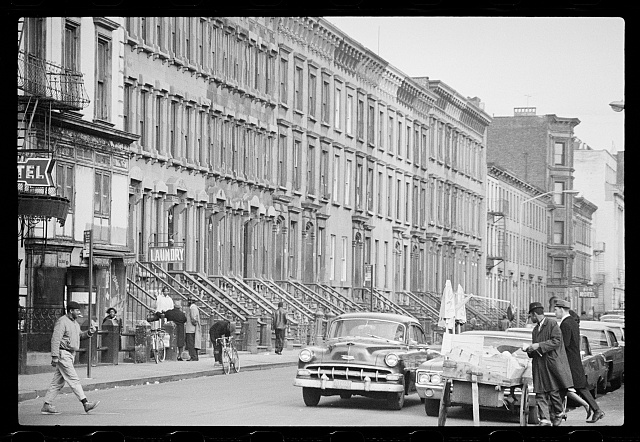 [Rowhouses along a street in Harlem, New York City]